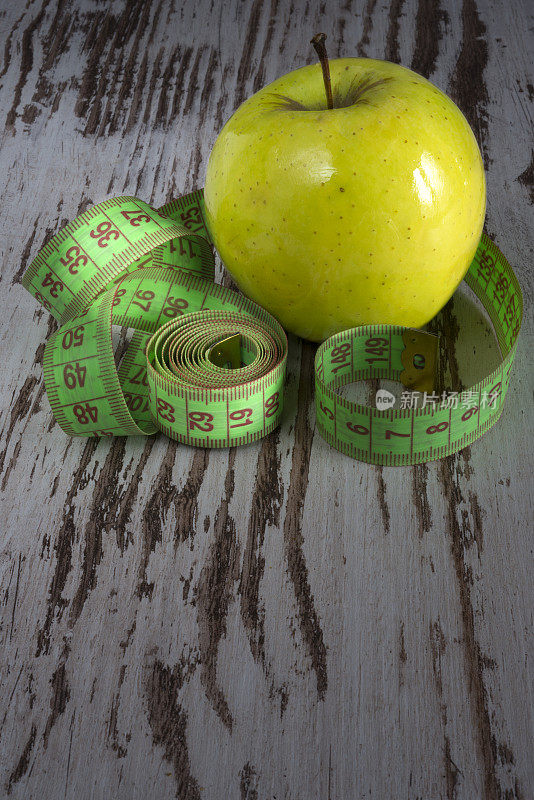 Healthy green apple fruit after fitness work-out to eat
